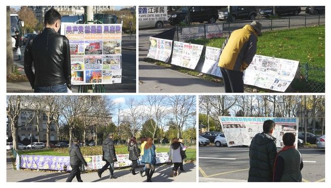 Chinese tourists reading the materials on Falun Gong's display boards