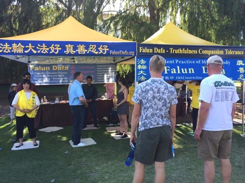 Learning the Falun Dafa exercises at San Diego Earth Day event in Balboa Park