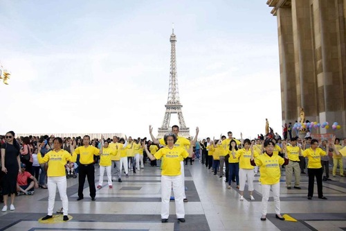 Group exercises in front of the Eiffel Tower on May 8, 2016