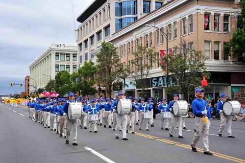 The Divine Land Marching Band led the Falun Gong group in the parade.