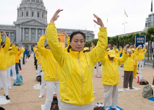 Group exercises in front of the San Francisco City Hall