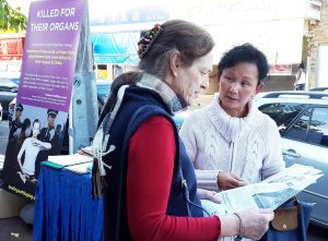 Falun Gong practitioner raising awareness about the persecution of falun gong in China.