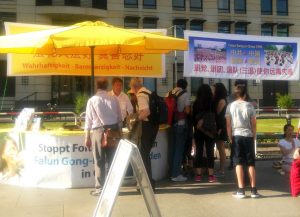 Falun Gong practitioners tell people about Falun Gong and the persecution in China on June 11, 2016.