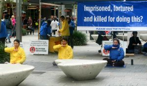 Demonstrating the Falun Gong exercises in downtown, Perth, Australia, on June 11.