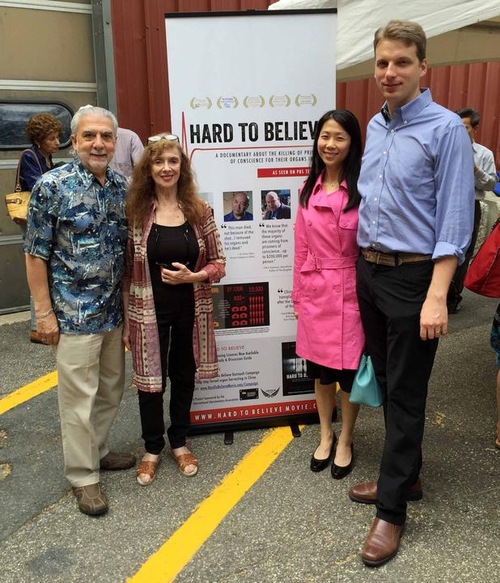 Penny Stoil (second from left) compared the persecution of Falun Gong to Nazi crimes.