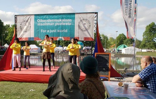 Demonstrating the Falun Gong exercises in Helsinki, Finland at the 2016 World Village Festival.