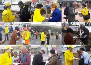 Passersby sign petition.