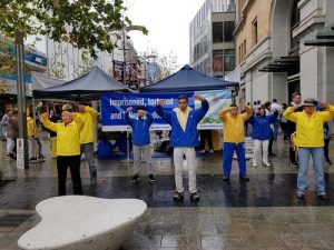 Falun Gong practitioners demonstrate exercises.