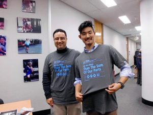 A Falun Gong practitioner with Daniel Kwon (right)