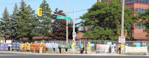 Falun Gong practitioners hold banners to draw public attention to the persecution in China.