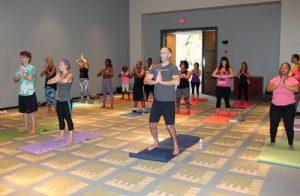 People learn the Falun Gong exercises in the Yoga Expo.