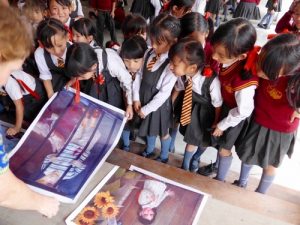 Through paintings from The Art of Zhen-Shan-Ren International Exhibition, young children in the Northeast of India learn about the injustice happening to children in China.