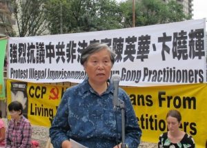 Chen Yinghua's mother, Ms. Huang Jinling, spoke at a press conference in Calgary, Canada, on August 19, 2014, urging the release of Chen and Bian.