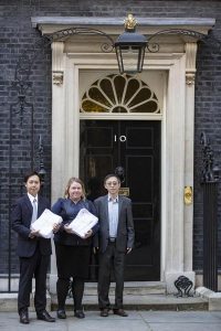 Dr. Alex Chen of DAFOH (left), and Dr. Liu and Helen, representatives of UK Falun Dafa Association, submit petition.