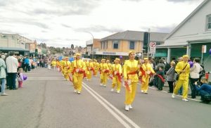 Falun Gong's waist drum team performs in the Tulip Time Festival parade in Bowral, Australia