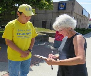 A woman hurried out of the Yarmouth City Hall to catch up with practitioners, and asked to sign the petition.