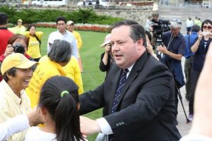 MP Jason Kenney at the rally shaking hands with practitioners.