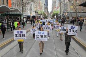 Banners and placards bearing messages to bring chief perpetrators of the persecution to justice.