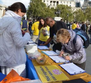 Demonstrating exercises and collecting signatures at Trafalgar Square.