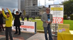 Retired police officer Tom signs the petition