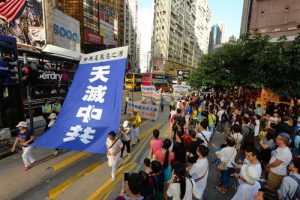 Banners call on the Chinese to quit the Communist Party so as to stand up against its atrocities.