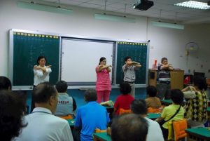 Learning the Falun Dafa exercises.