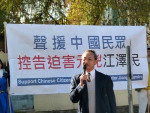 Democracy advocate Liangyiong Fei speaks at the rally.