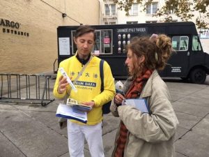 Christophe Flecharo believes that coming to San Francisco and talking to the tourists is a great way to let more people know about the persecution.