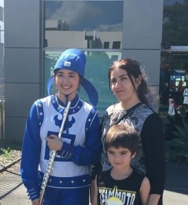 Shawn (pictured with her son) wishes the Tian Guo Marching Band can someday perform in China.