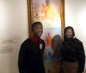 Mrs. Clark and her son in front of their favorite painting.