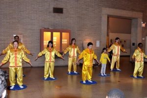 Falun Gong practitioners demonstrate the exercises on stage of Chinese New Year celebration in University of Pennsylvania on January 21, 2017.