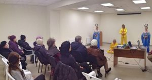 Demonstrating the Falun Dafa meditation exercises.