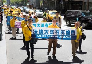 Practitioners from England attended the march in New York City on May 12 to celebrate the 18th annual World Falun Dafa Day.