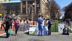 A passerby at Columbia University reading the readily made materials.