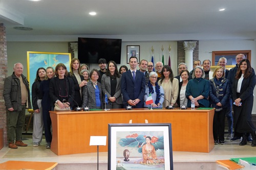 Group photo of city councilors, speakers, organizers and attendees

