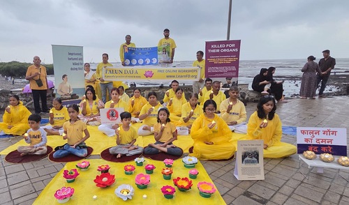 Falun Dafa practitioners hold a candlelight vigil in Mumbai to protest the 26-year-long persecution of Falun Dafa in China.

